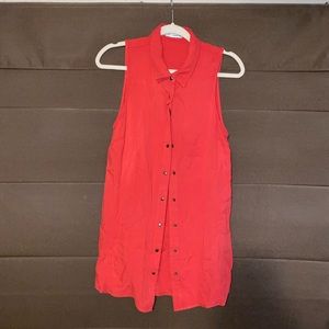 Reddish orange sleeveless button up top